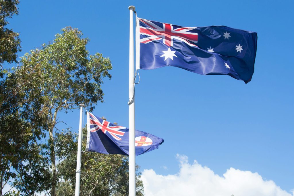 Two Australian FLag with a Sky Background